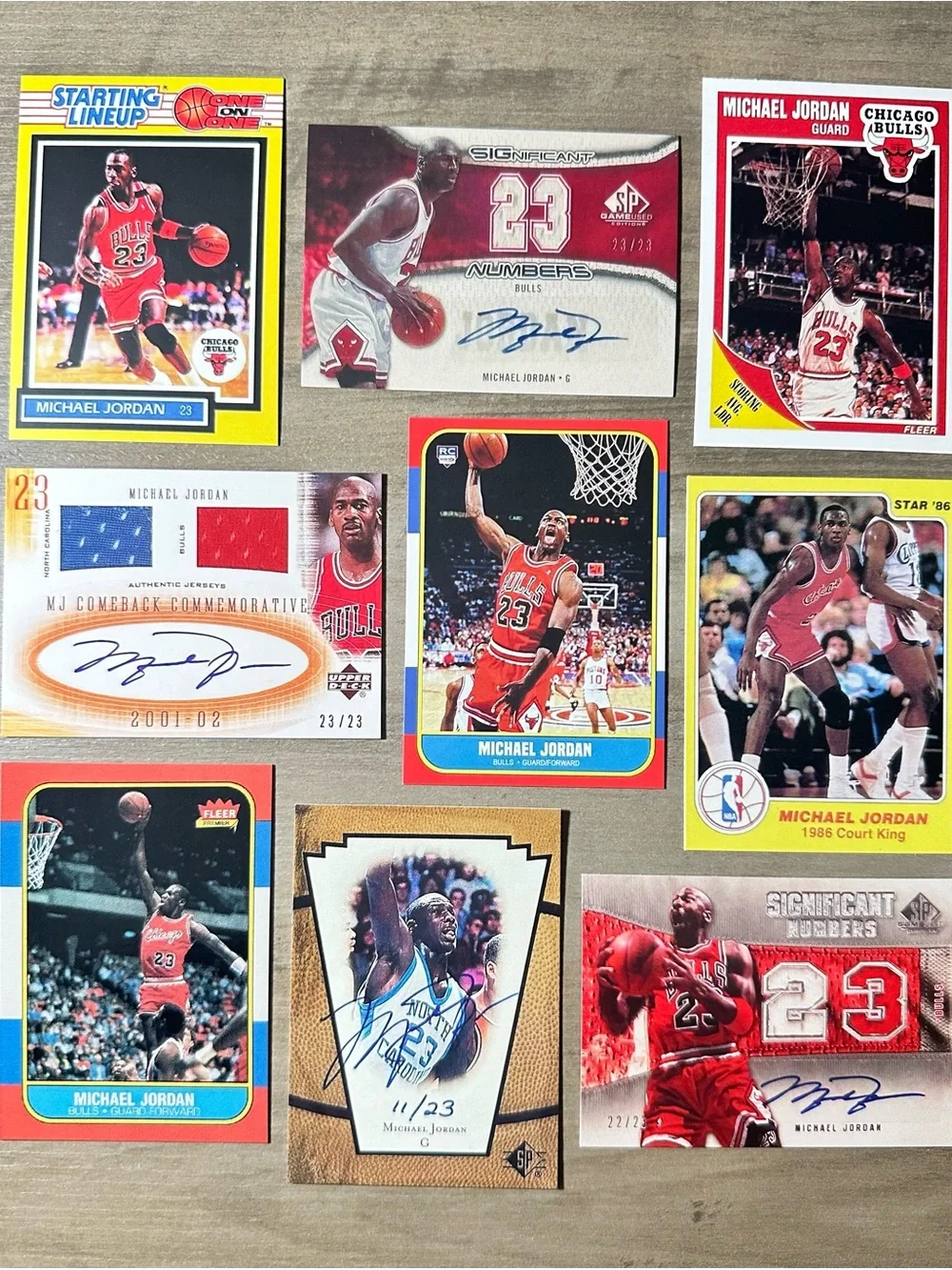 Michael Jordan Signed Rookie Lot of (9) Star UD Starting Lineup Novelty Cards.